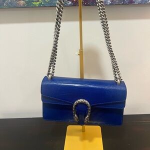 Brand new Gucci limited edition Dionysus exotic lizard in royal blue color way.